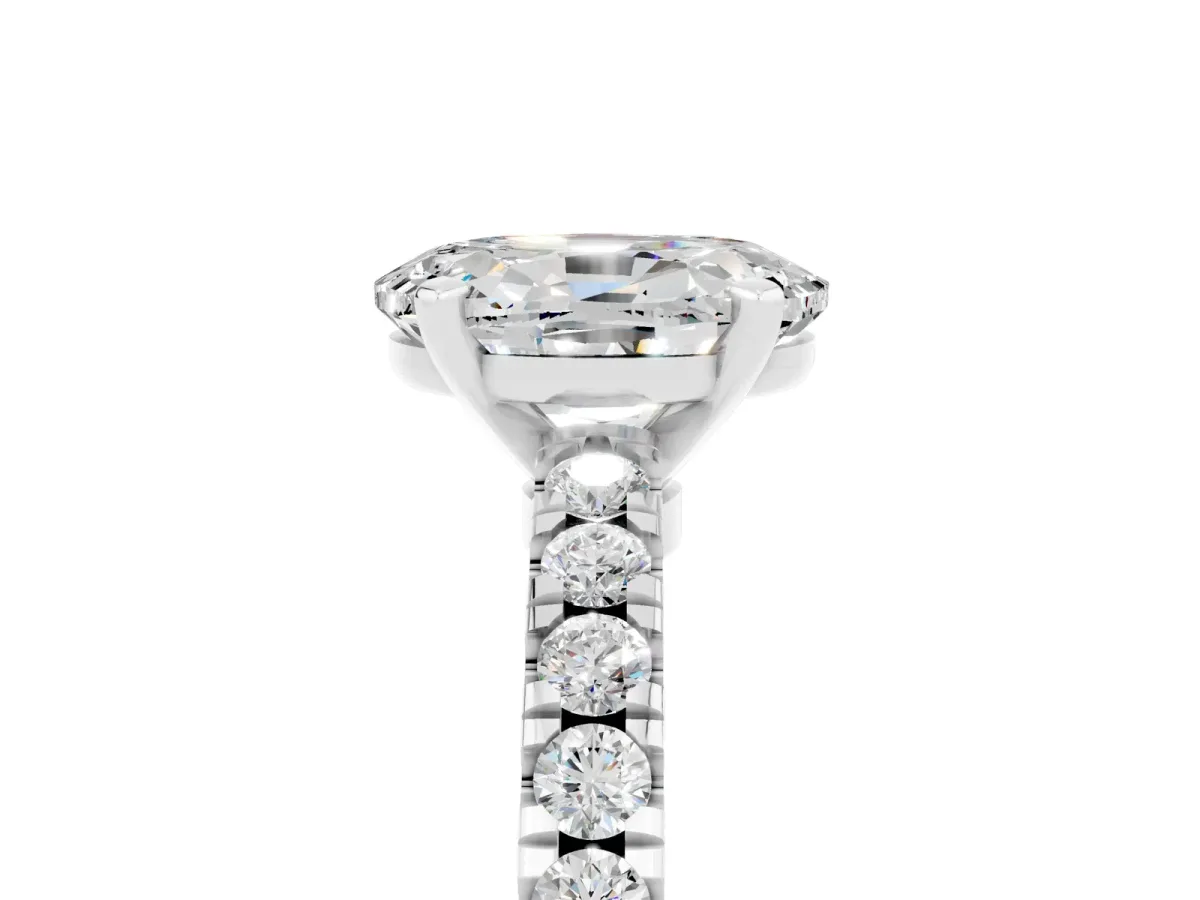 Oval Cut Solitaire Moissanite with Pavé Band and Four-Prong Setting Silver