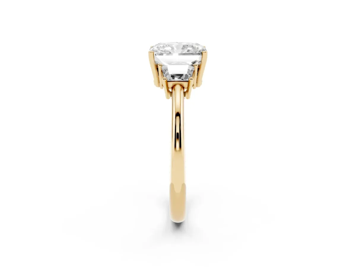Radiant Cut Diamond Three-Stone Ring with Trapezoid Side Stones and Prong Setting Yellow gold