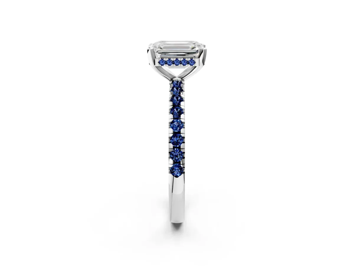 Emerald Cut Diamond Solitaire Ring with Round Blue Sapphire Pavé Band and Four-Prong Setting Silver
