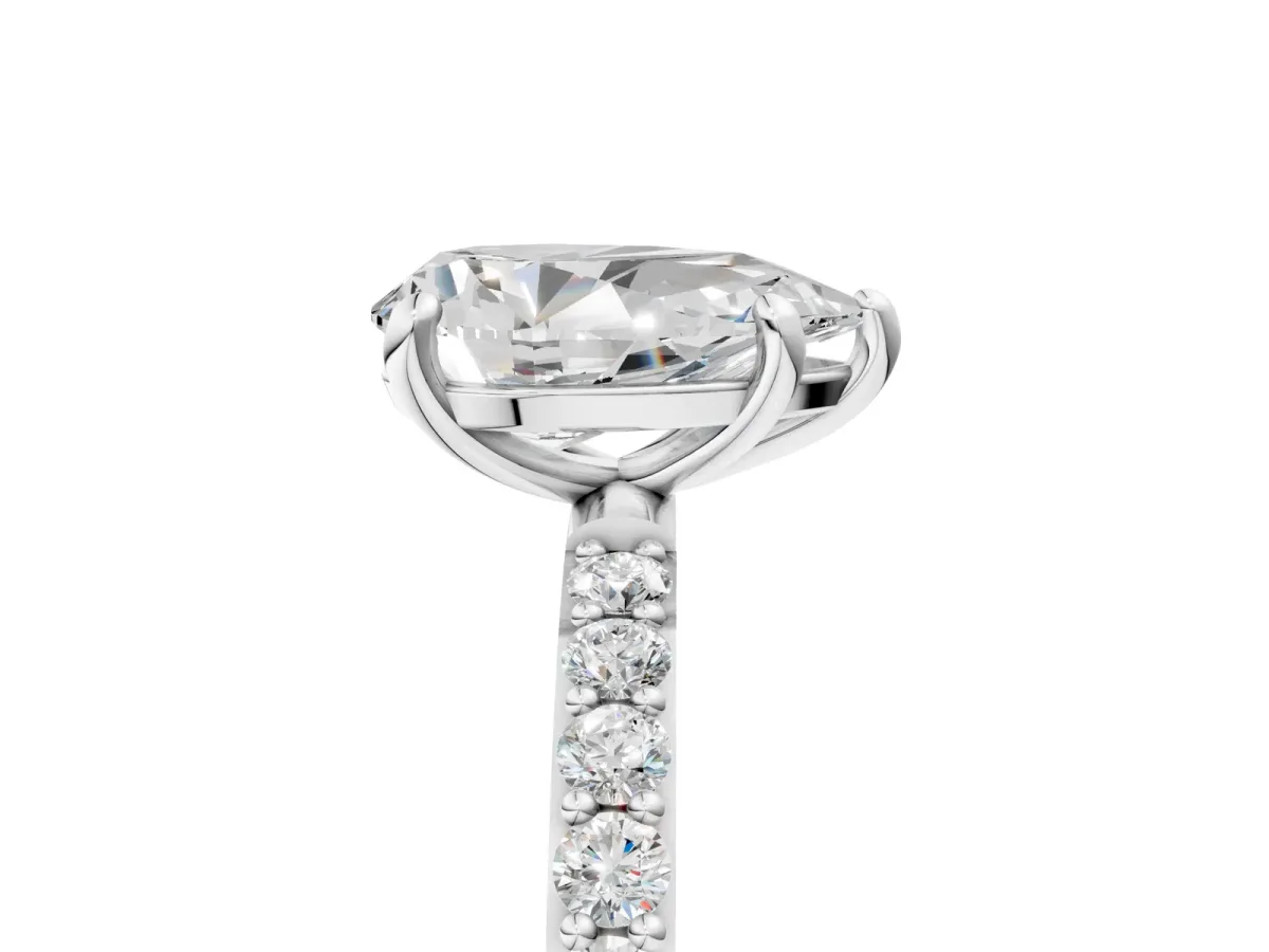 Pear Cut Diamond Solitaire Ring with Round Moissanite Pavé Band and Prong Setting Silver