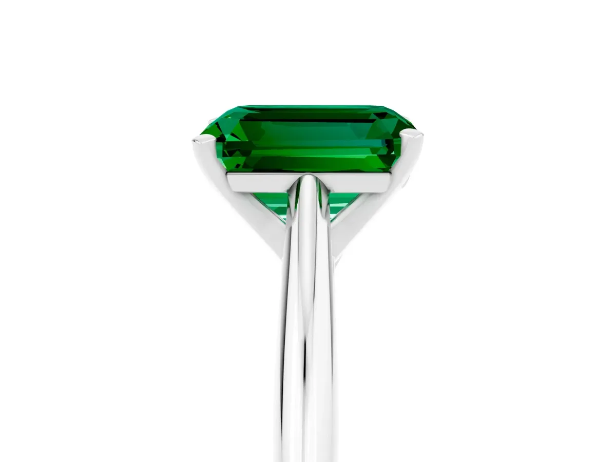 Emerald Cut Emerald Solitaire Engagement Ring with Cathedral Setting and Four-Prong Mount White gold