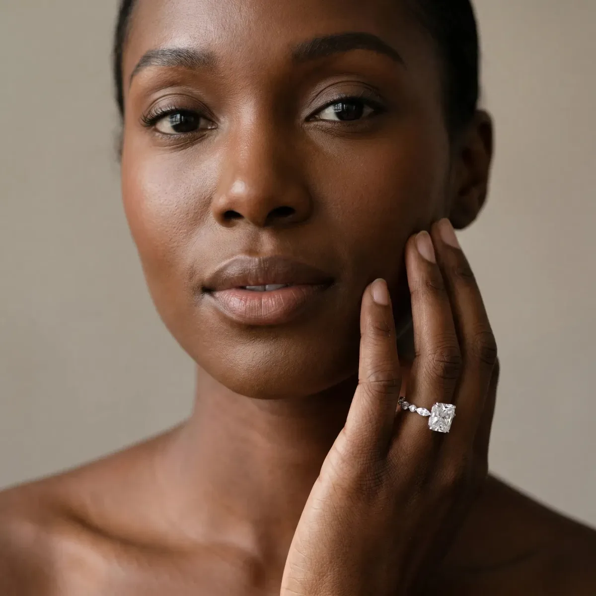 Radiant Cut Diamond Ring with Marquise and Round Side Stones and Four-Prong Setting Silver