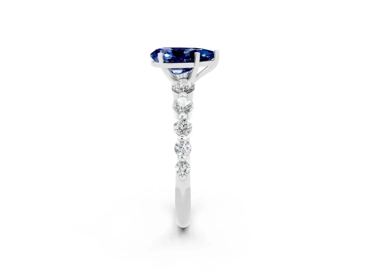Pear Cut Solitaire Blue Sapphire Ring with Pave Band and Four-Prong Setting Platinum