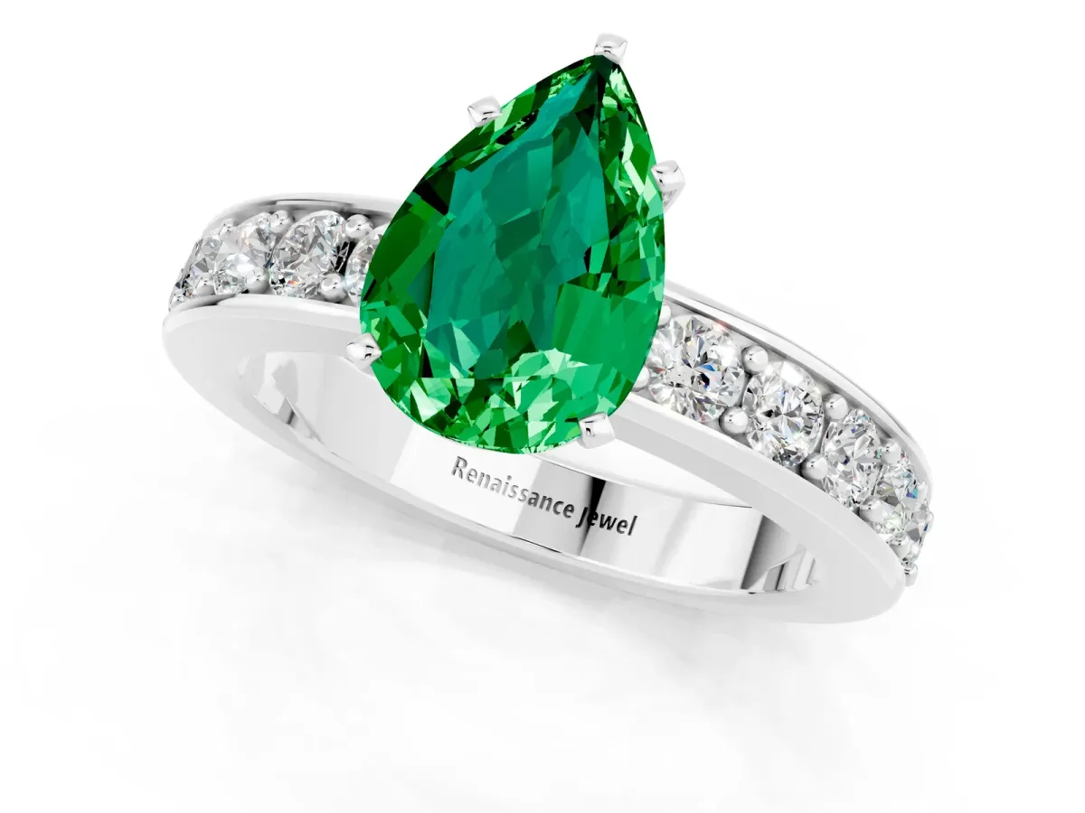 Pear Cut Emerald Engagement Ring with Channel Set Round Band and Prong Setting White gold