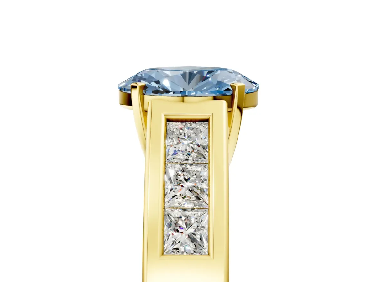 Fancy Blue Oval Cut Cut Channel Set Solitaire Ring with Four-Prong Setting Yellow gold