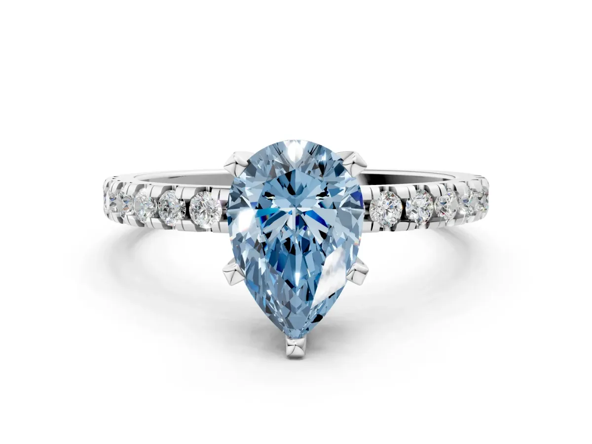 Fancy Blue Pear Cut Diamond Solitaire Ring with Round Pavé Band and Four-Prong Setting Silver