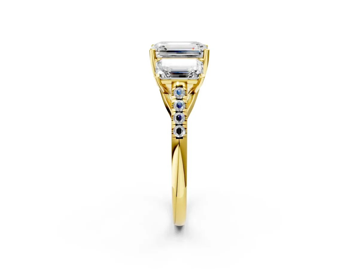 Fancy Blue Three-Stone Emerald Cut Diamond Ring with Round Pavé Band and Prong Setting Yellow gold