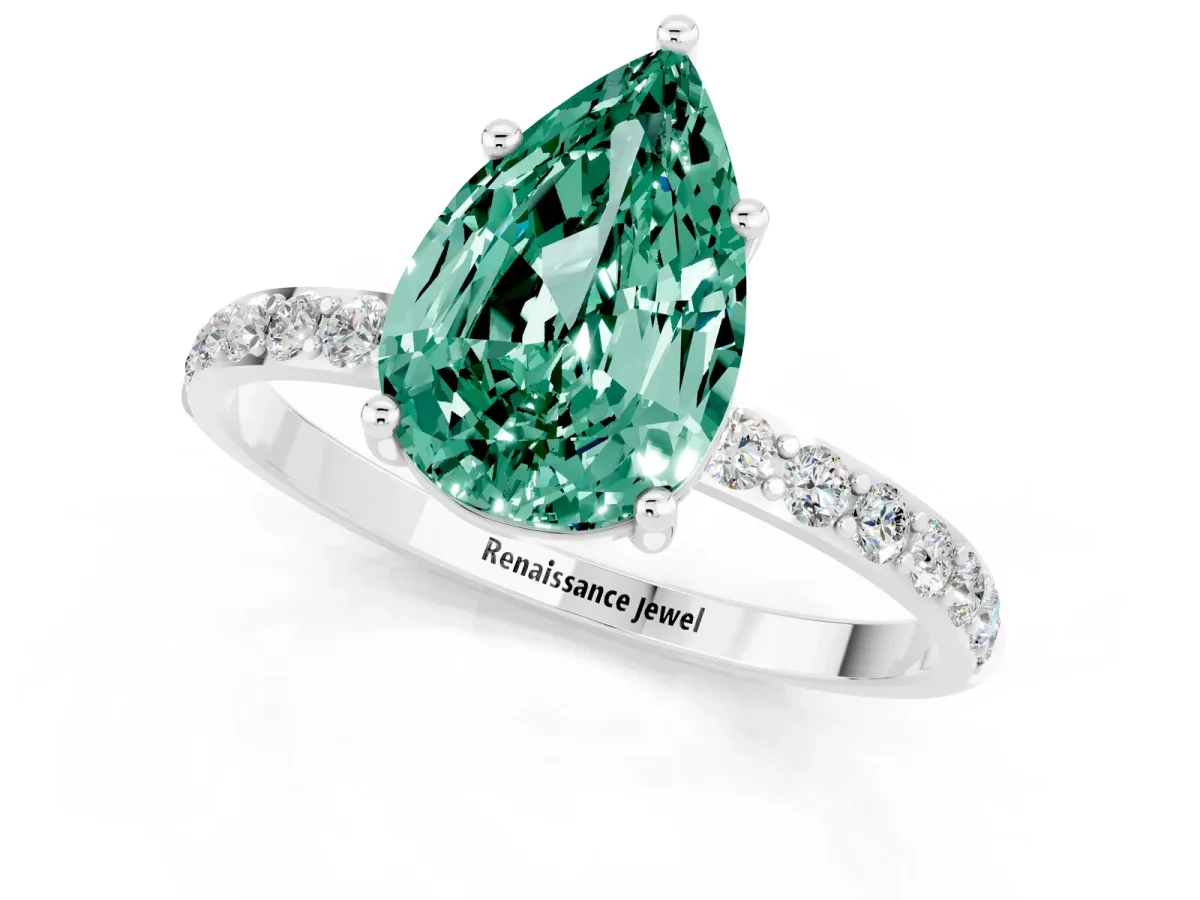 Pear Cut Green Sapphire Solitaire Ring with Round Pavé Band and Prong Setting Silver