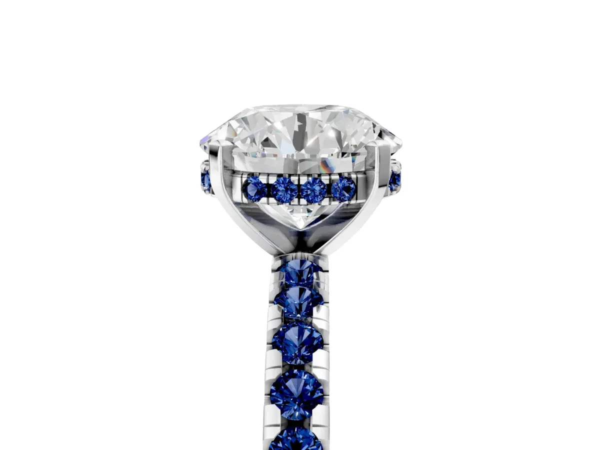 Round Cut Diamond Solitaire Ring with Round Blue Sapphire Pavé Band and Four-Prong Setting Silver