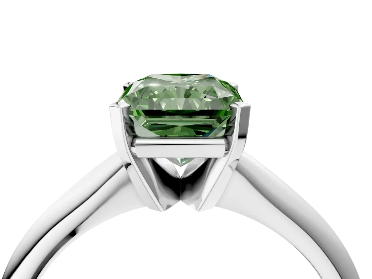 Fancy Green Radiant Cut Cut Solitaire Ring with Four-Prong Setting on a Classic Band Platinum