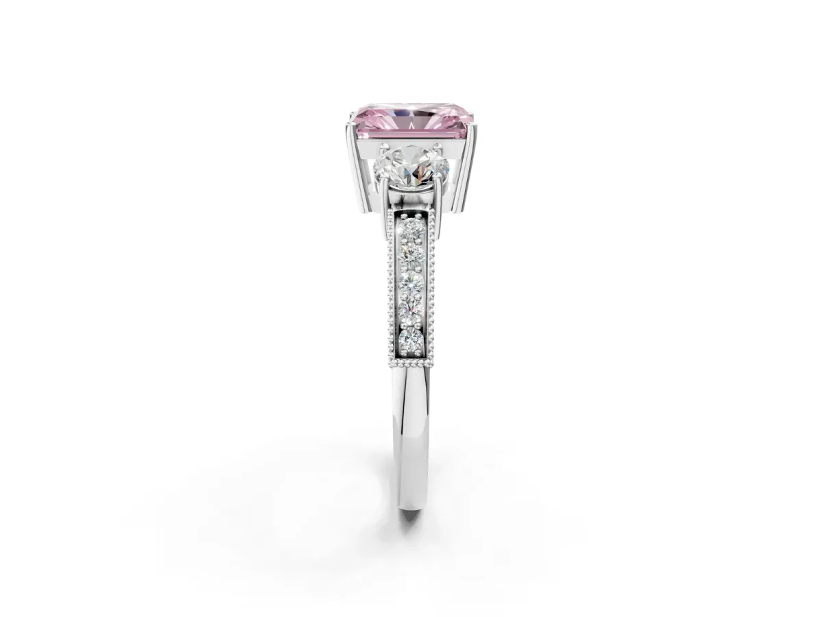 Fancy Pink Radiant Cut Three-Stone Diamond Ring with Pavé Band and Four-Prong Setting Platinum