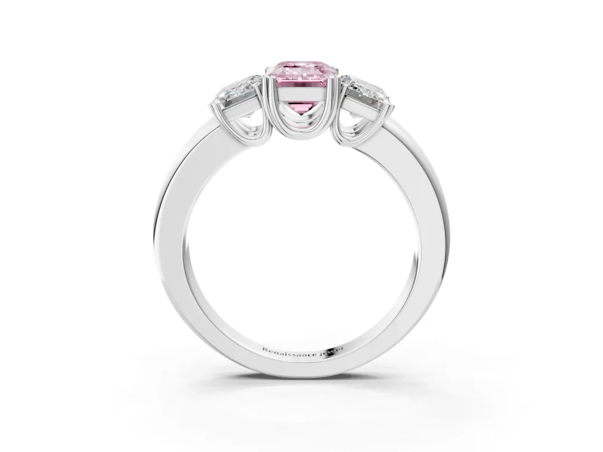 Fancy Pink Three-Stone Emerald Cut Cut Diamond Ring with Channel Set Band and Four-Prong Setting Platinum