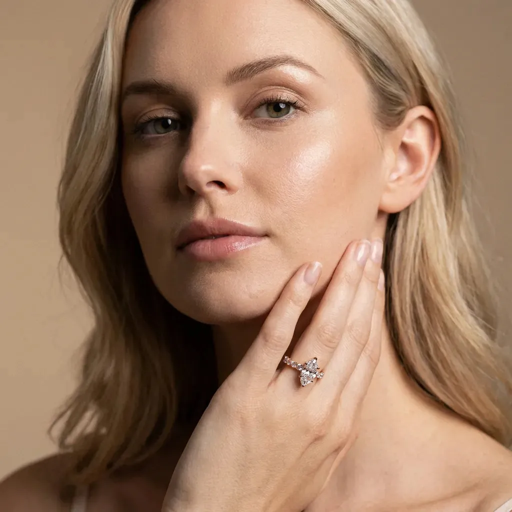 Marquise Cut Diamond Side Stone Solitaire Ring with Round and Four-Prong Setting Rose gold