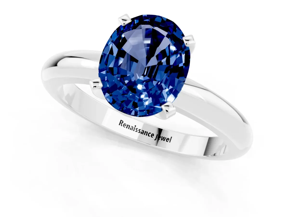 Oval Cut Blue Sapphire Solitaire Engagement Ring with Round Band and Four-Prong Setting Silver