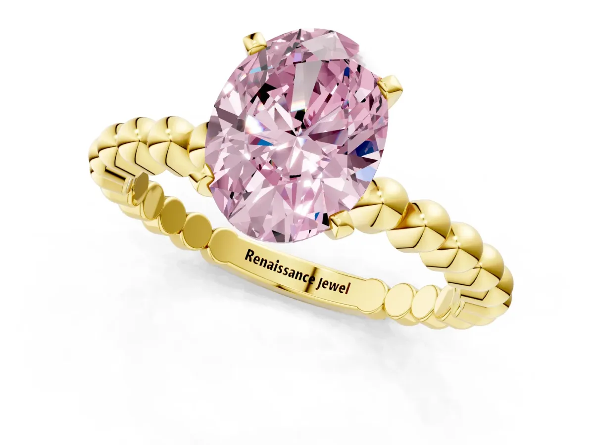 Fancy Pink Oval Cut Diamond Solitaire Ring with Beaded Band and Prong Setting Yellow gold