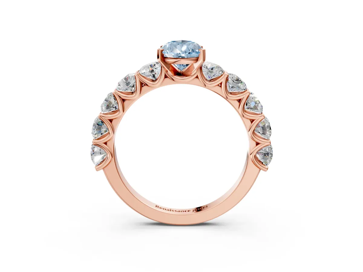 Fancy Blue Pear Cut Diamond Prong Setting with Side Stones on a Pave Band Rose gold