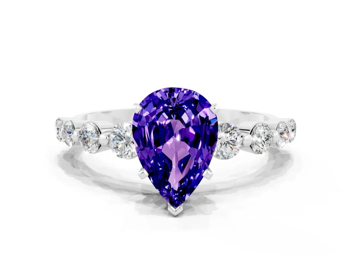 Pear Cut Solitaire Tanzanite Ring with Pave Band and Four-Prong Setting Platinum