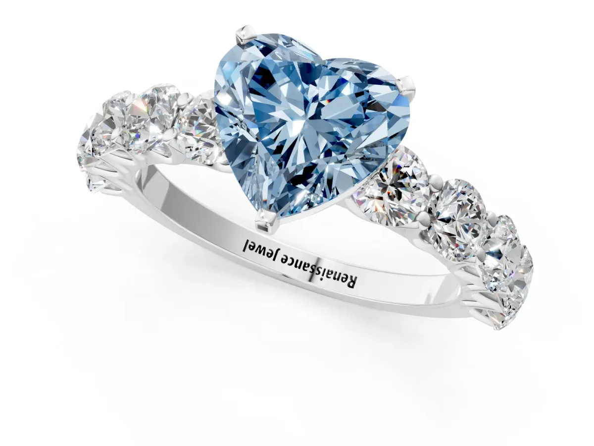 Fancy Blue Heart Cut Diamond Prong Setting with Side Stones on a Pave Band Silver