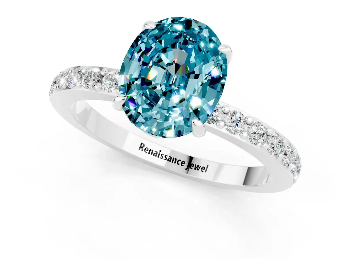 Oval Cut Blue Topaz Solitaire Engagement Ring with Pavé Band and Four-Prong Setting Silver