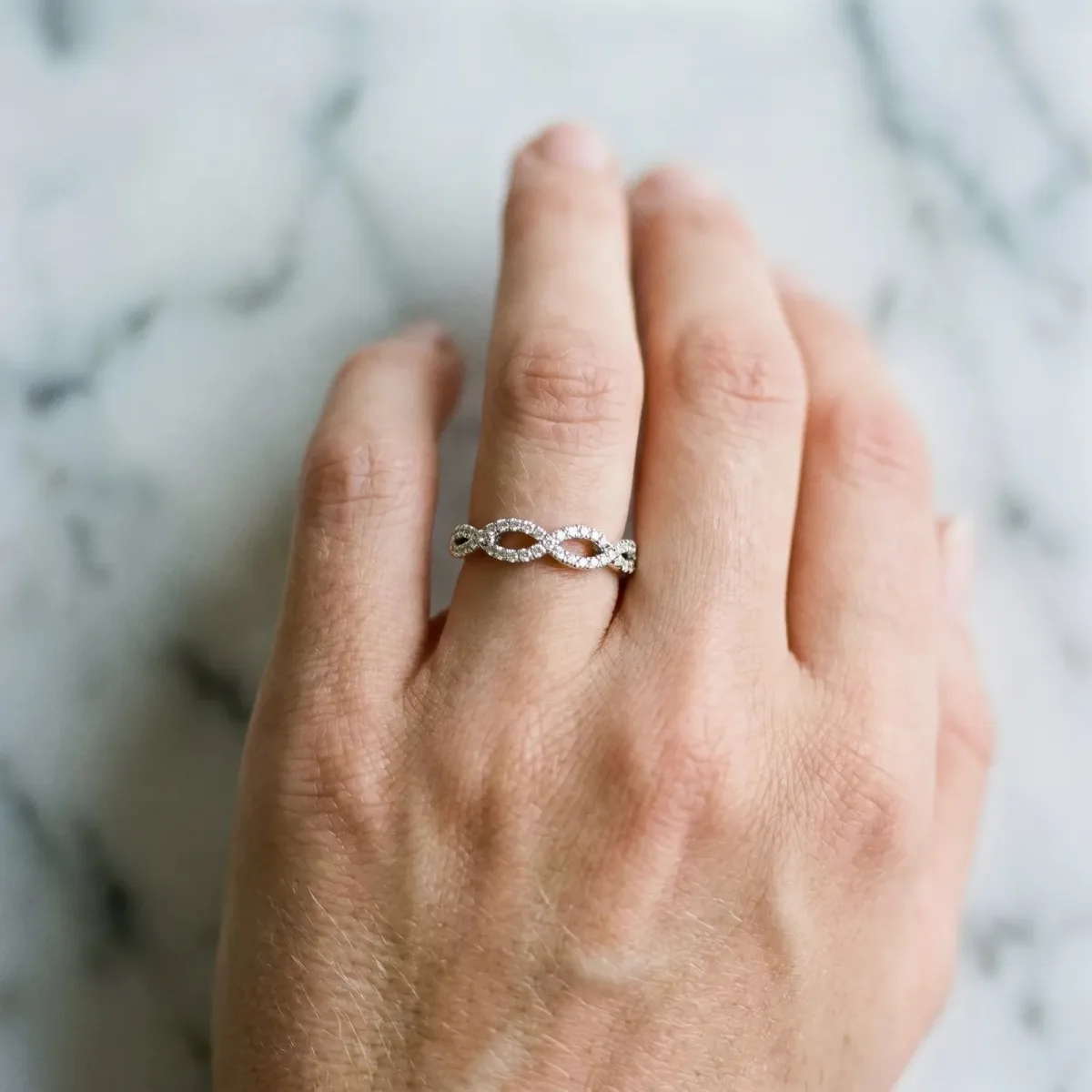 Infinity Twist Diamond Pavé Band with Round Stones and Prong Setting Silver