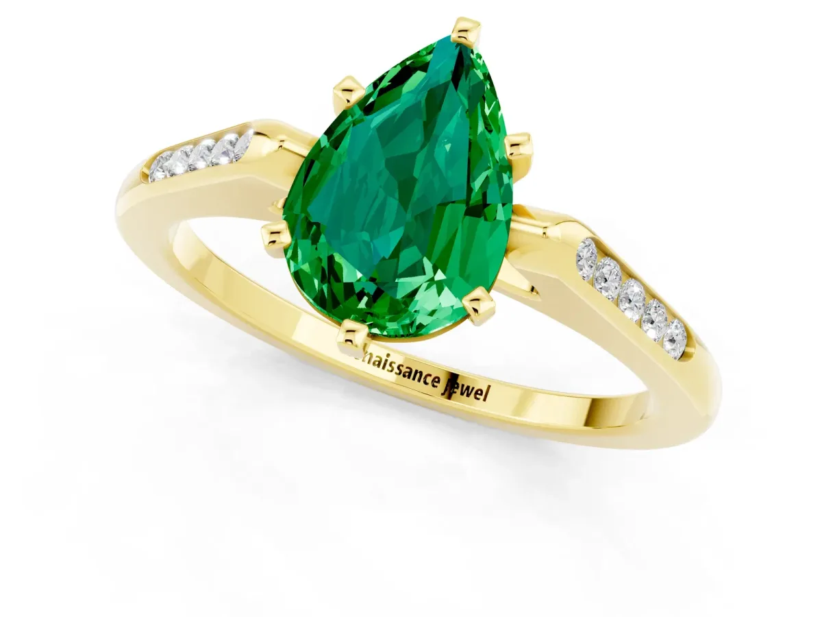 Pear Cut Emerald Solitaire Ring with Channel Set Round Band and Prong Setting Yellow gold
