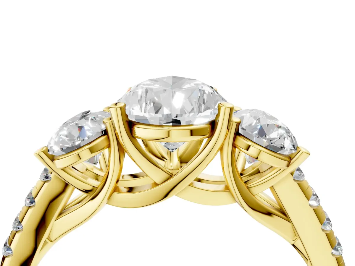 Three-Stone Pear Cut Diamond Ring with Round Pavé Band and Prong Setting Yellow gold