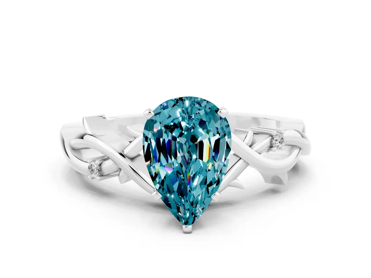 Pear Cut Blue Topaz Solitaire Ring with Twisted Band and Prong Setting Platinum