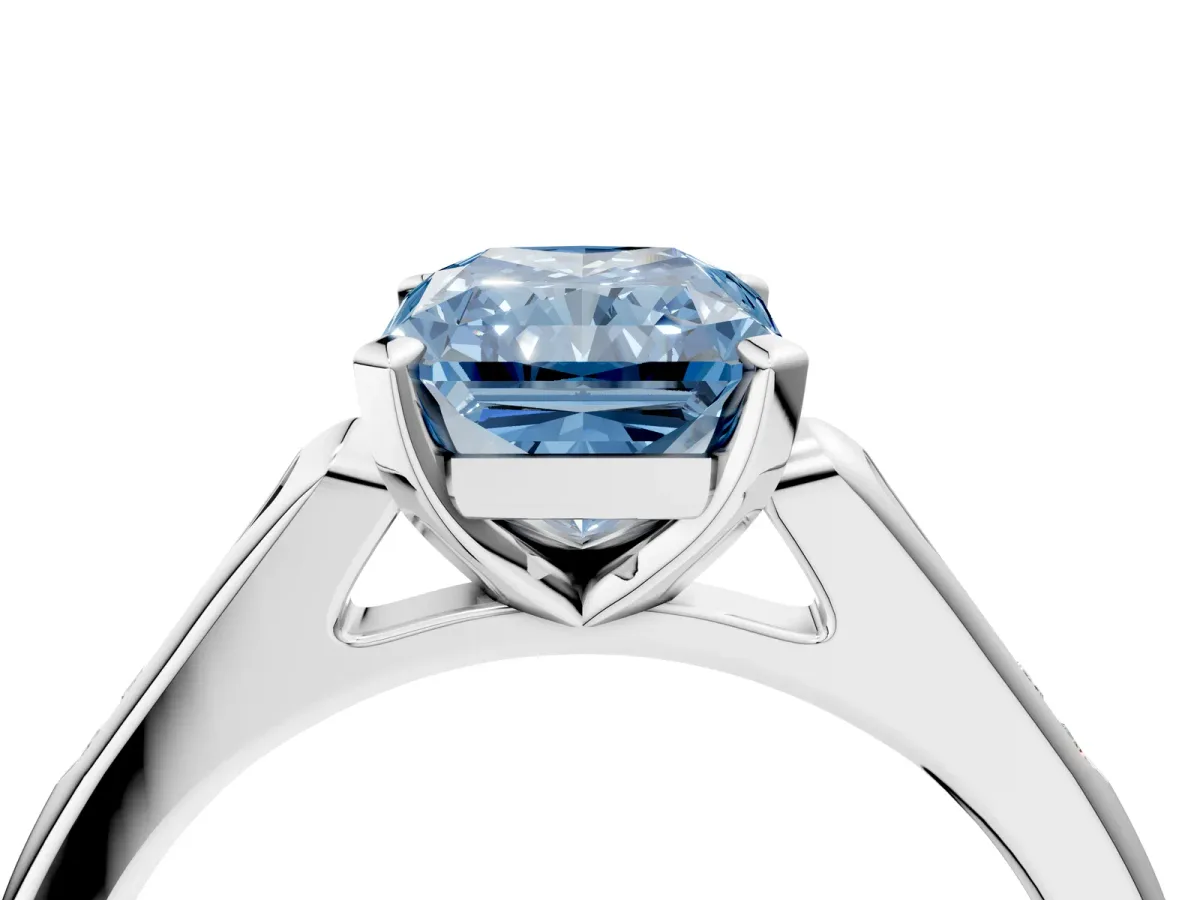 Fancy Blue Radiant Cut Diamond Solitaire Ring with Channel Set Round Band and Prong Setting Silver