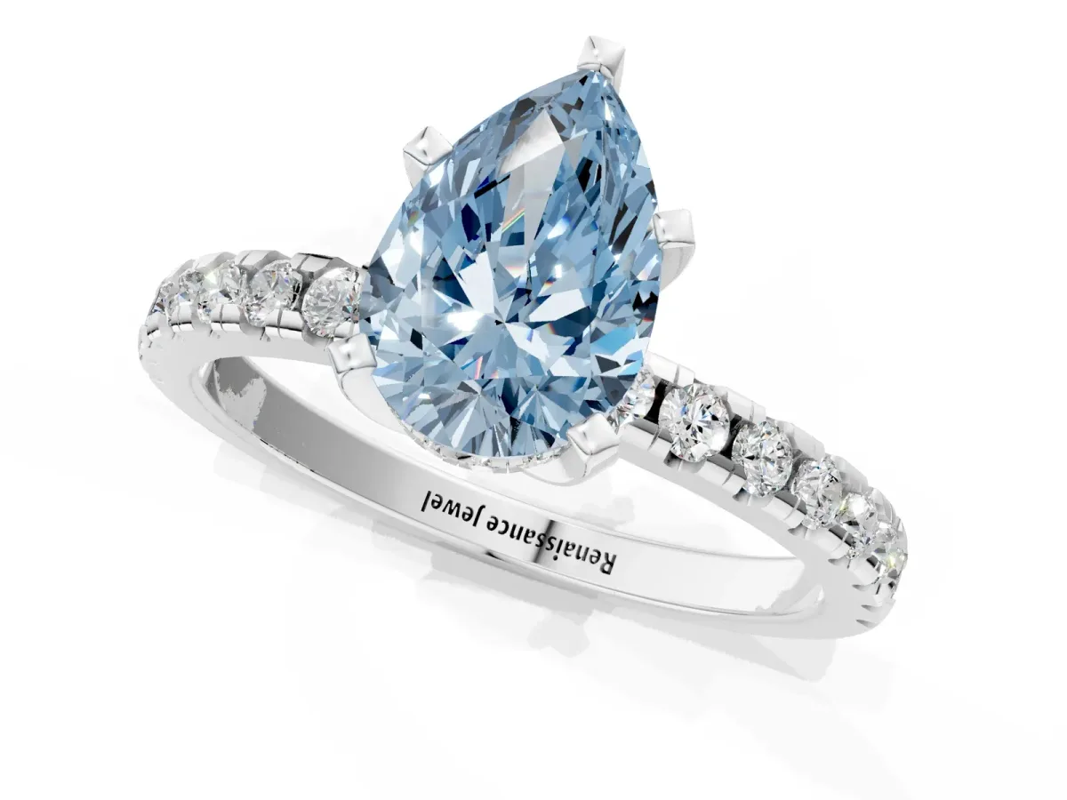 Fancy Blue Pear Cut Diamond Solitaire Ring with Round Pavé Band and Four-Prong Setting Silver