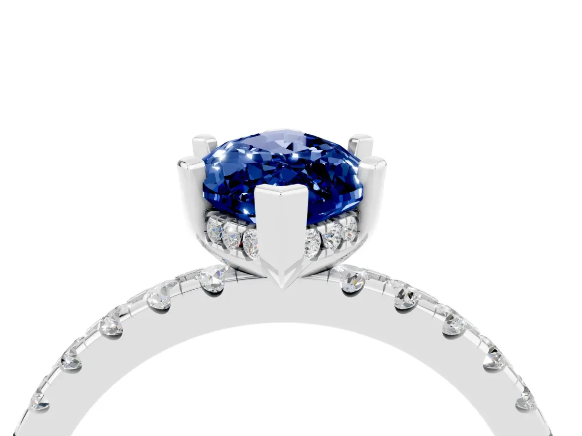Marquise Cut Blue Sapphire Solitaire Ring with Round Pavé Band and Four-Prong Setting Silver