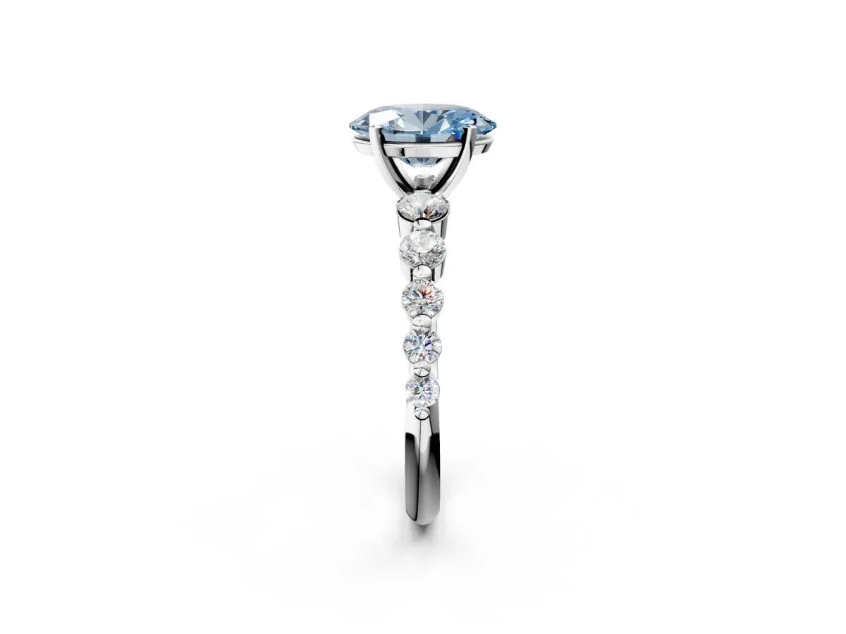 Fancy Blue Oval Cut Solitaire Diamond Ring with Pave Band and Four-Prong Setting Silver