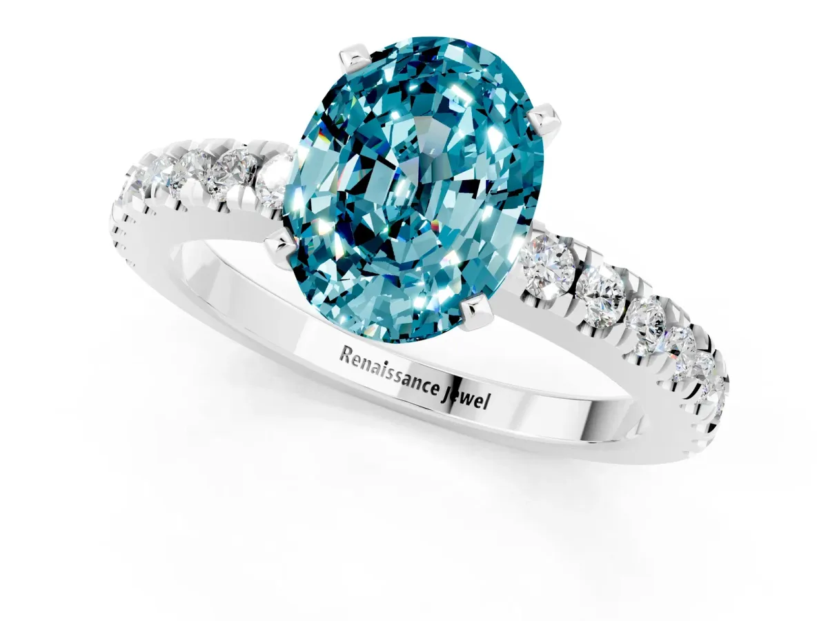 Oval Cut Solitaire Blue Topaz with Pavé Band and Four-Prong Setting Silver