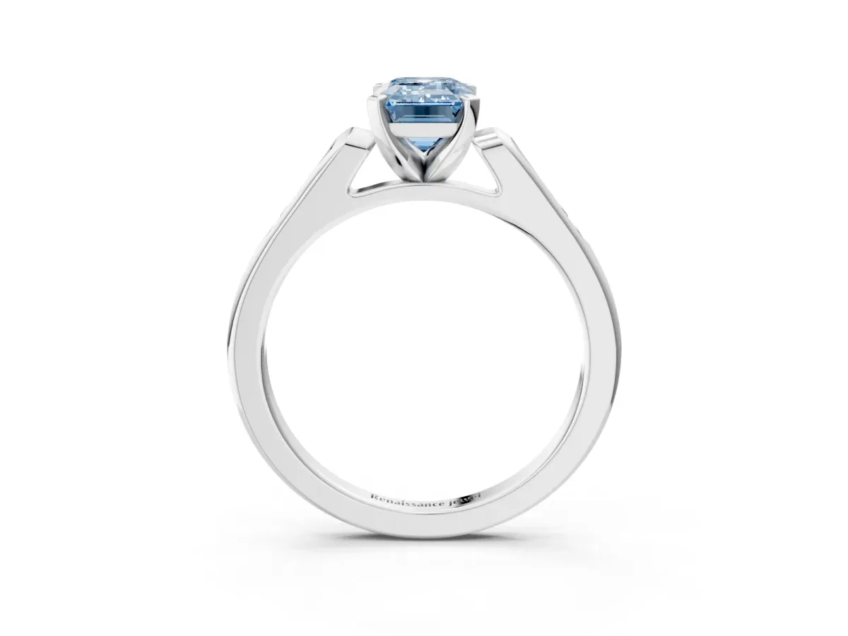 Fancy Blue Emerald Cut Diamond Solitaire Ring with Channel Set Round Band and Prong Setting White gold