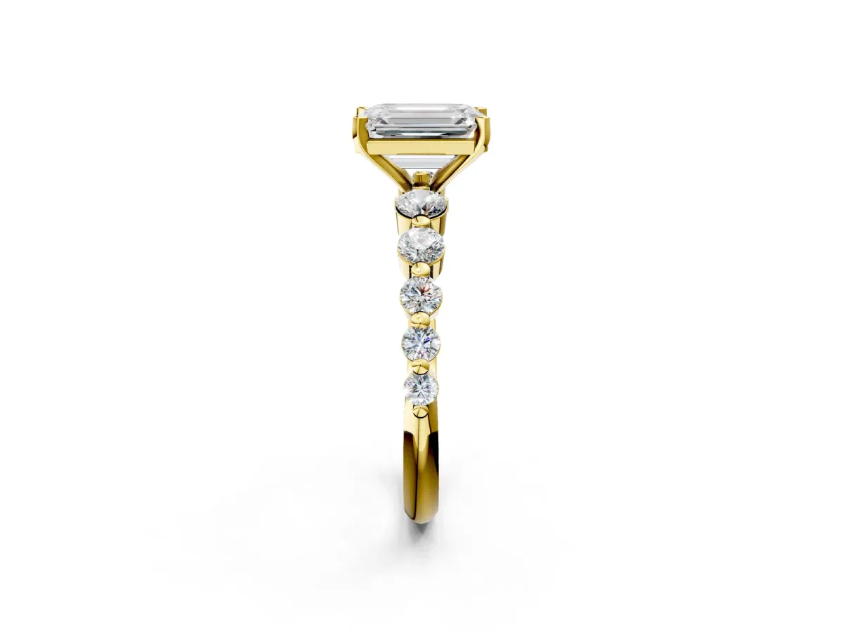 Emerald Cut Solitaire Diamond Ring with Pave Band and Four-Prong Setting Yellow gold