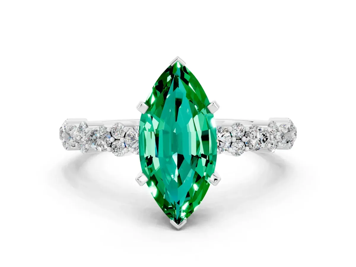 Marquise Cut Emerald Side Stone Solitaire Ring with Round and Four-Prong Setting Silver