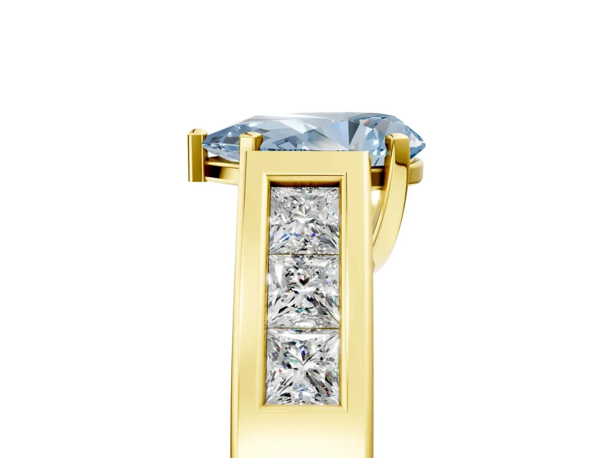 Fancy Blue Pear Cut Cut Channel Set Solitaire Ring with Four-Prong Setting Yellow gold
