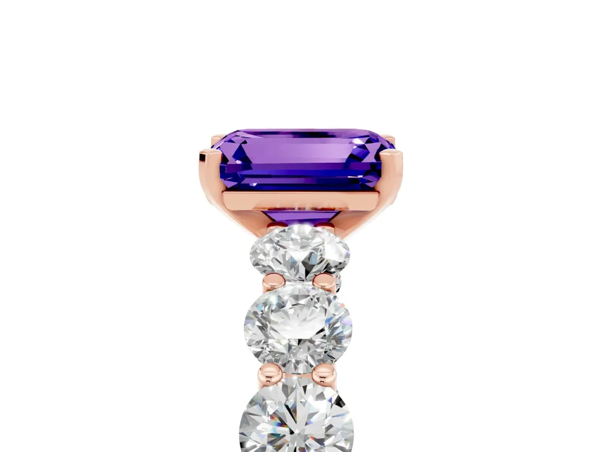 Emerald Cut Tanzanite Prong Setting with Side Stones on a Pave Band Rose gold