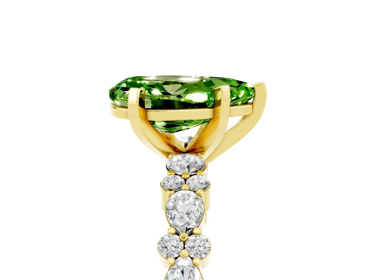 Pear Cut Peridot Side Stone Solitaire Ring with Round and Four-Prong Setting Yellow gold