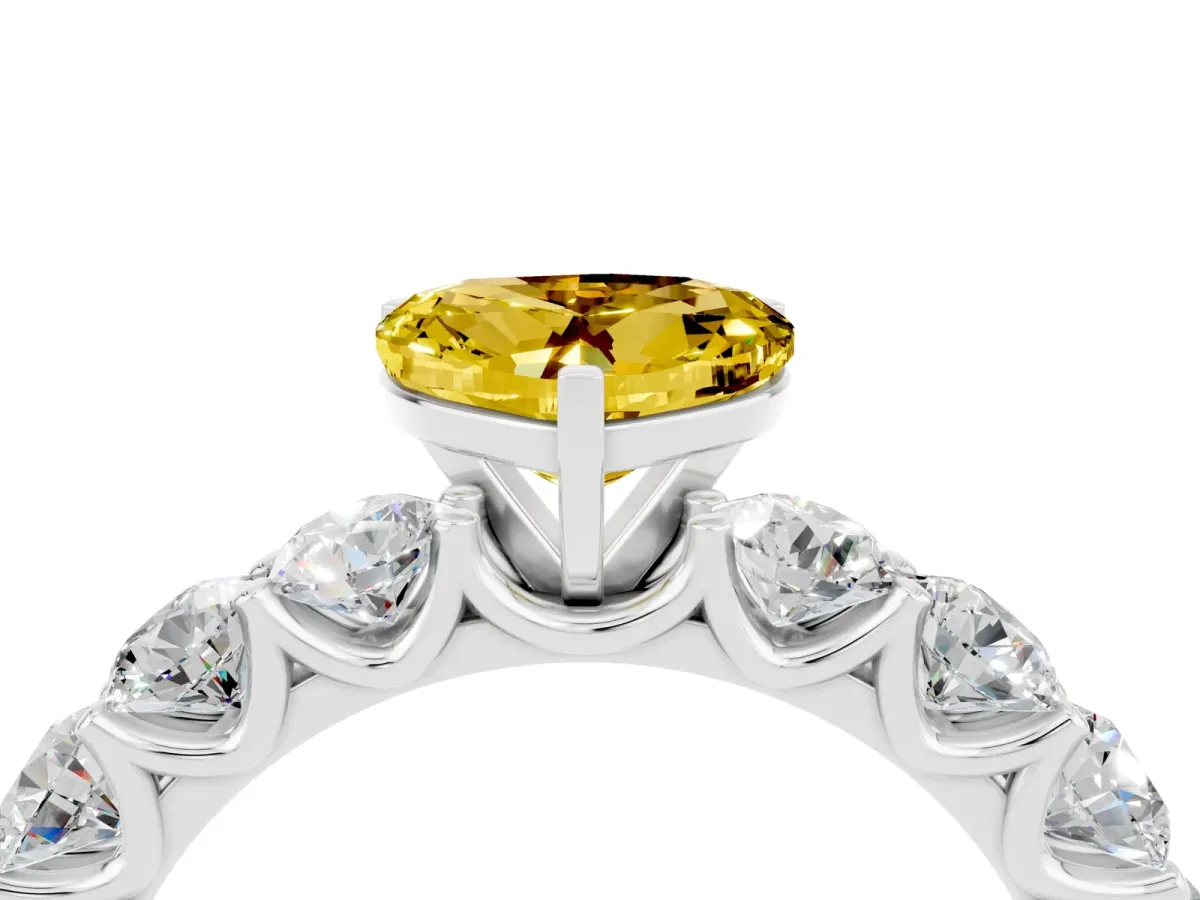 Heart Cut Yellow Sapphire Prong Setting with Side Stones on a Pave Band Silver
