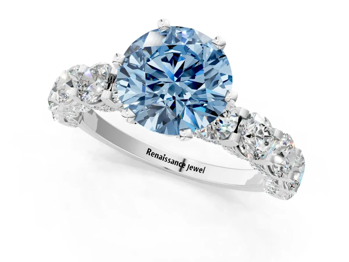 Fancy Blue Round Cut Diamond Side Stone Engagement Ring with Four-Prong Setting White gold