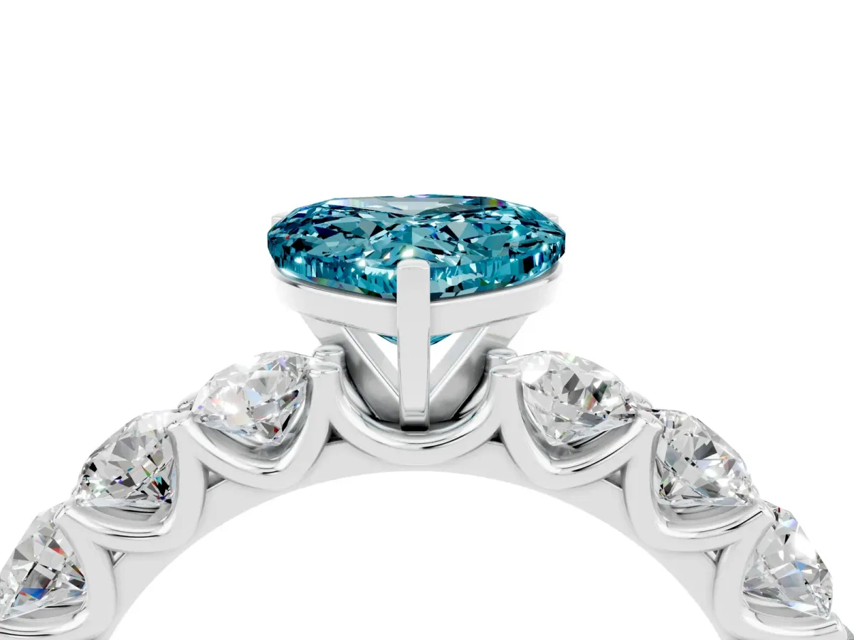 Heart Cut Blue Topaz Prong Setting with Side Stones on a Pave Band Silver
