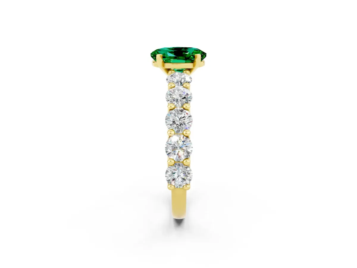 Oval Cut Emerald Prong Setting with Side Stones on a Pave Band Yellow gold