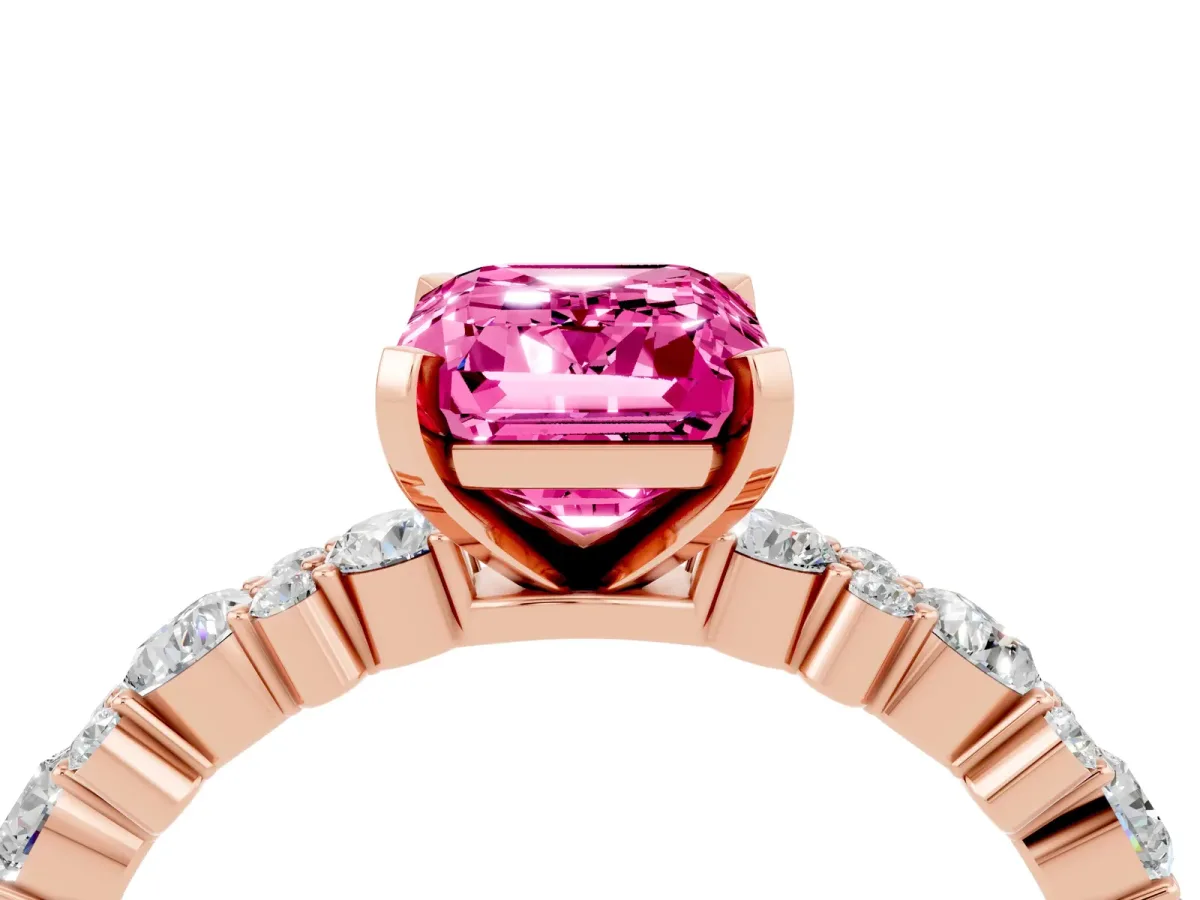 Emerald Cut Pink Sapphire Side Stone Solitaire Ring with Round and Four-Prong Setting Rose gold