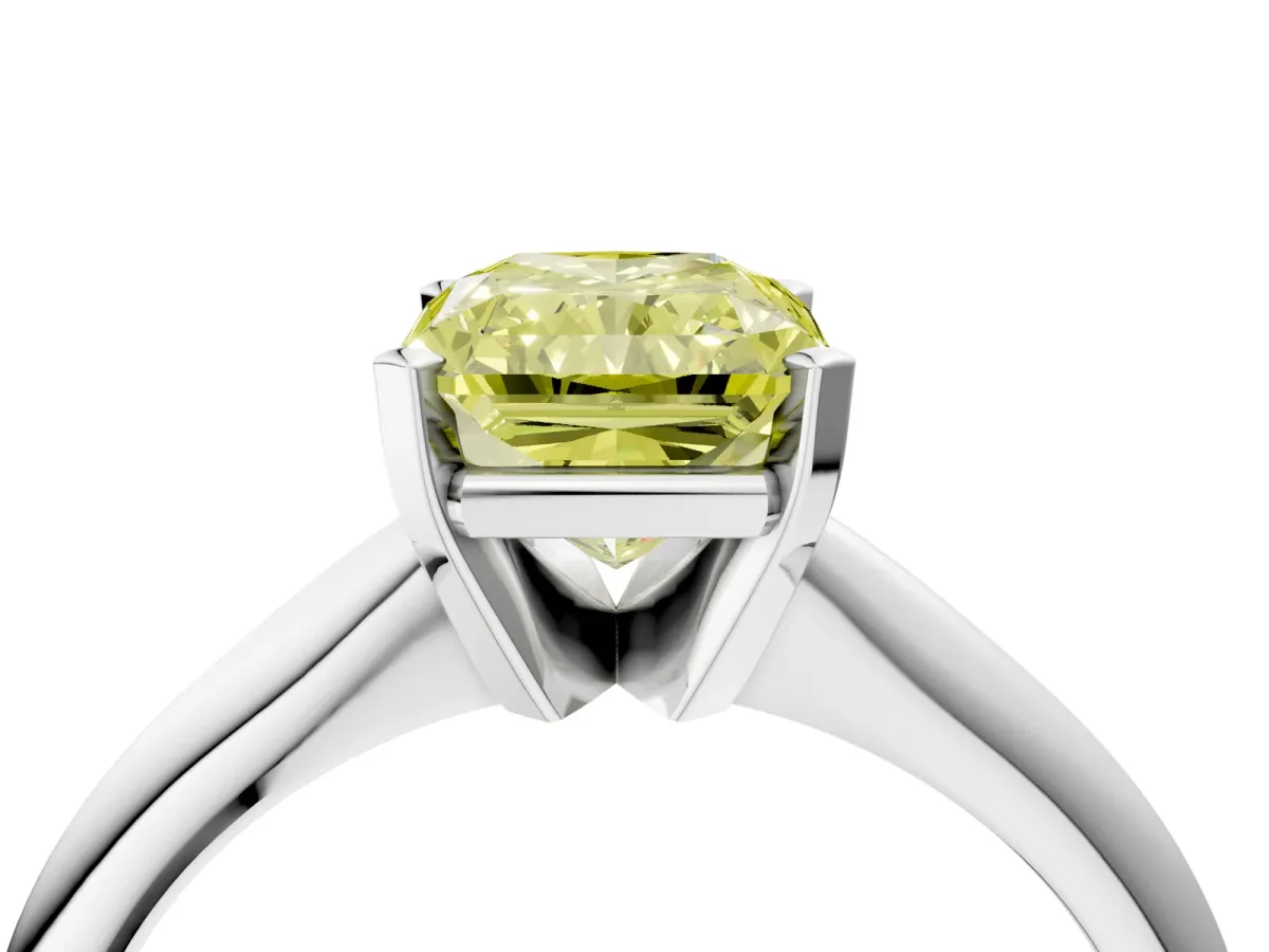 Fancy Yellow Radiant Cut Cut Solitaire Ring with Four-Prong Setting on a Classic Band Platinum