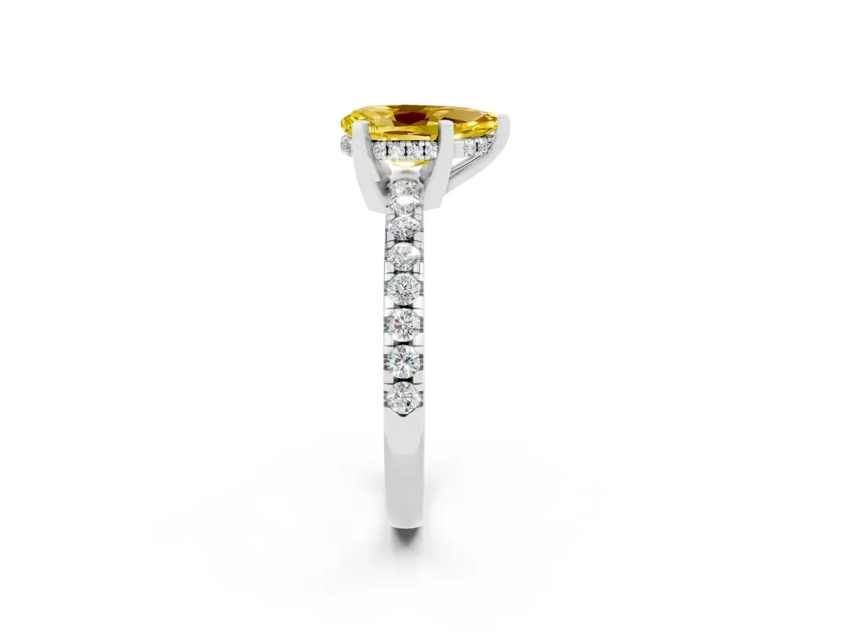 Pear Cut Yellow Sapphire Solitaire Ring with Round Pavé Band and Four-Prong Setting Silver