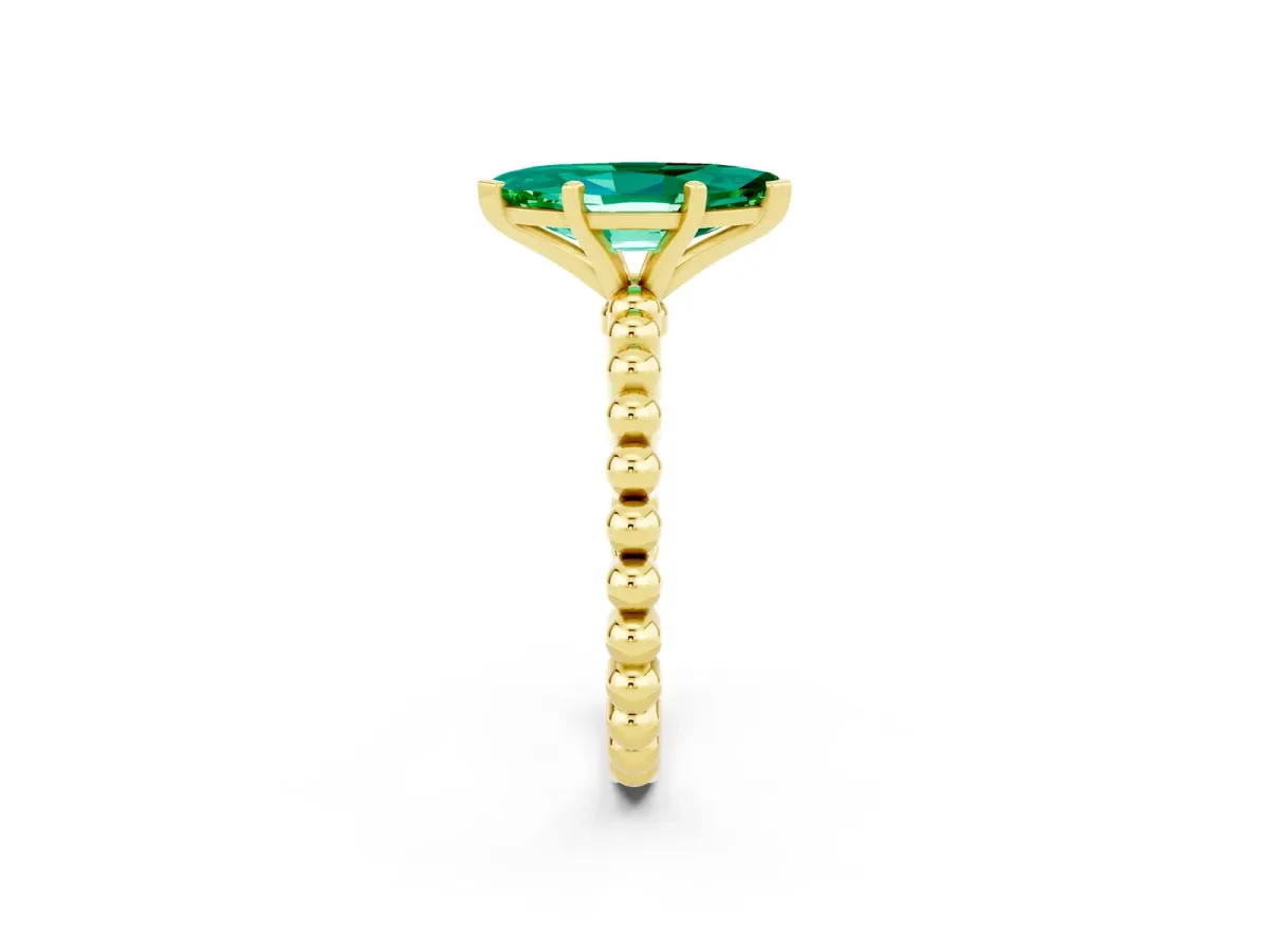 Marquise Cut Emerald Solitaire Ring with Beaded Band and Prong Setting Yellow gold