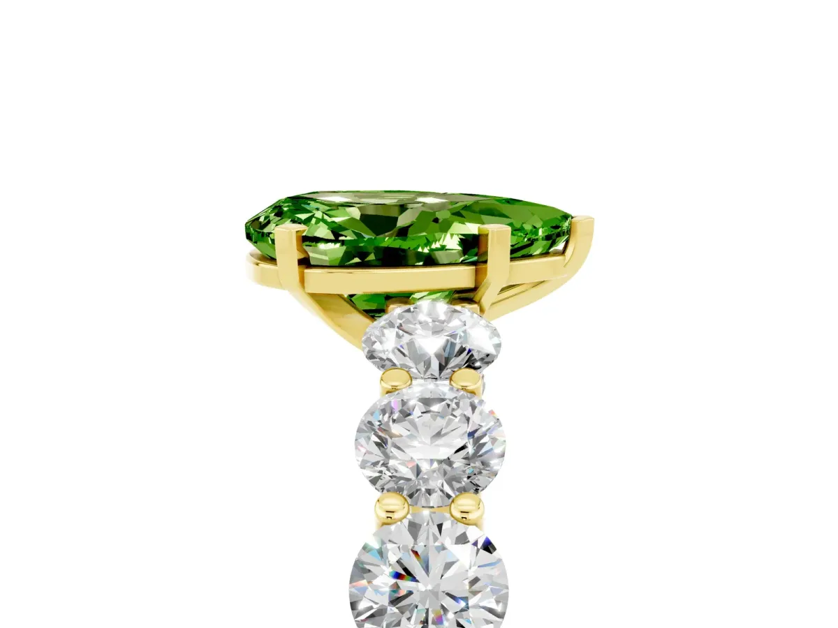 Pear Cut Peridot Prong Setting with Side Stones on a Pave Band Yellow gold