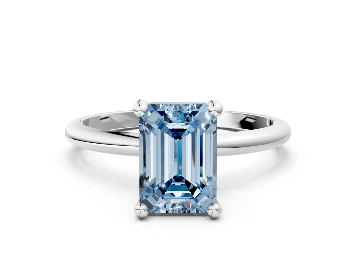 Fancy Blue Emerald Cut Solitaire Diamond Ring with 4-Prong Setting on a Classic Band Silver
