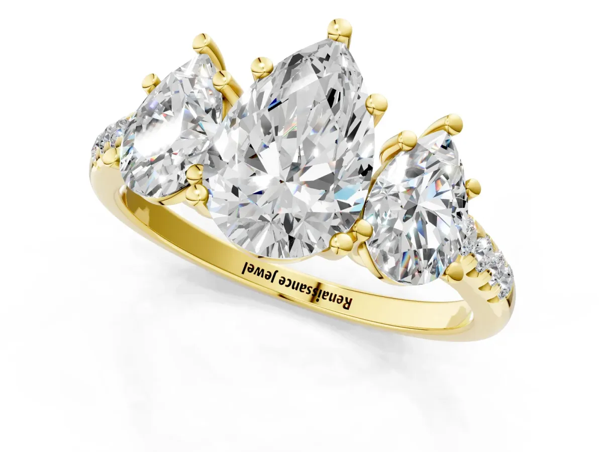 Three-Stone Pear Cut Diamond Ring with Round Pavé Band and Prong Setting Yellow gold