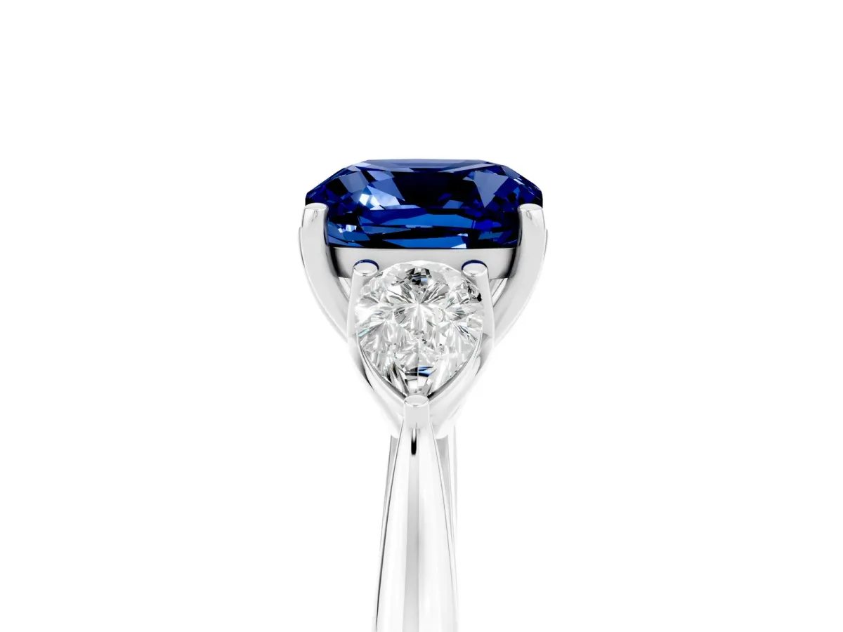 Three-Stone Cushion Cut Blue Sapphire Ring with Pear Side Stones in Four-Prong Setting White gold